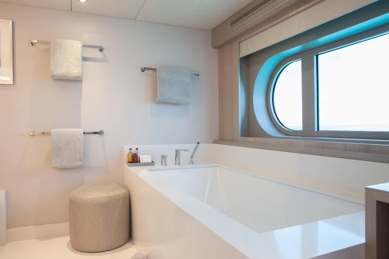 No Bad Ideas Yacht Photos Pics Luxurious bathroom on 2000 Trinity Yachts Trinity 160, featuring a modern bathtub and ocean view.