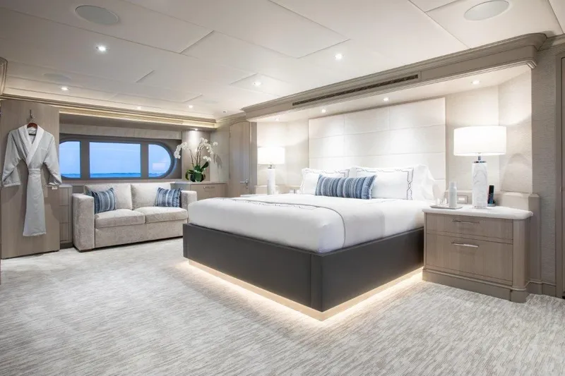 No Bad Ideas Yacht Photos Pics Luxurious bedroom interior on Trinity Yachts Trinity 160, featuring elegant decor and ambient lighting.