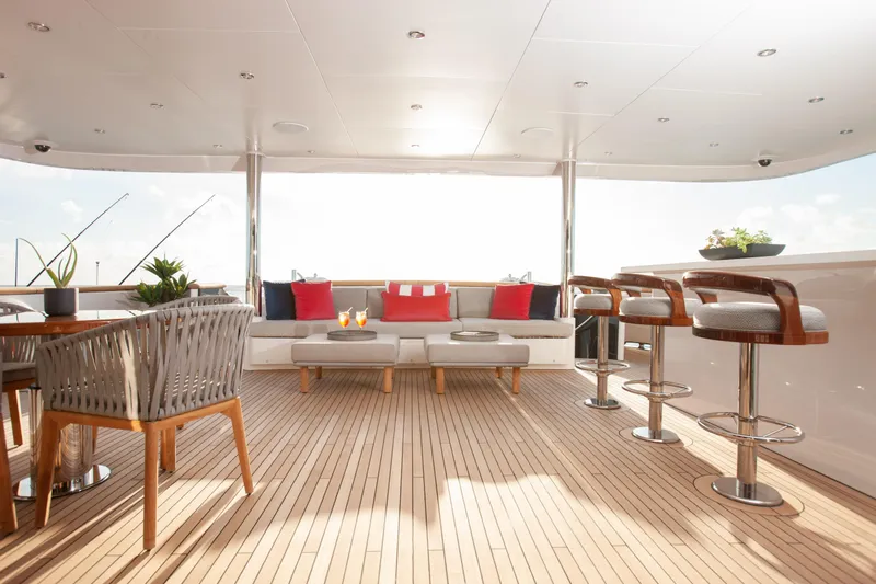 No Bad Ideas Yacht Photos Pics Luxurious deck of 2000 Trinity Yachts Trinity 160 with elegant seating and bar stools.