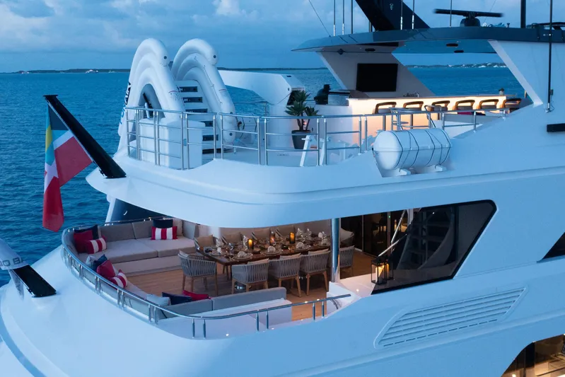 No Bad Ideas Yacht Photos Pics Luxurious Trinity Yachts 160, 2000 model, featuring elegant outdoor seating and dining area at sea.