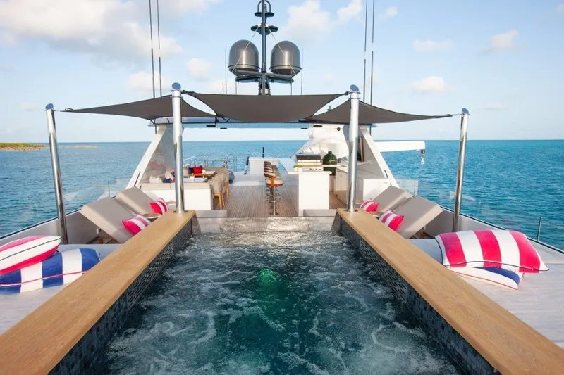 No Bad Ideas Yacht Photos Pics Luxurious Trinity 160 yacht deck with pool, sun loungers, and ocean view, 2000 model.