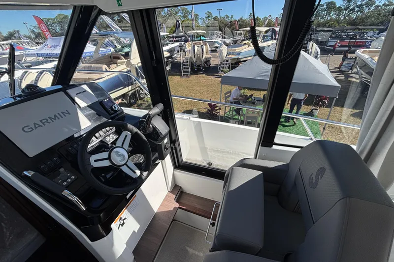  Yacht Photos Pics Interior view of 2026 Beneteau Antares 9 V2 boat with Garmin navigation system.