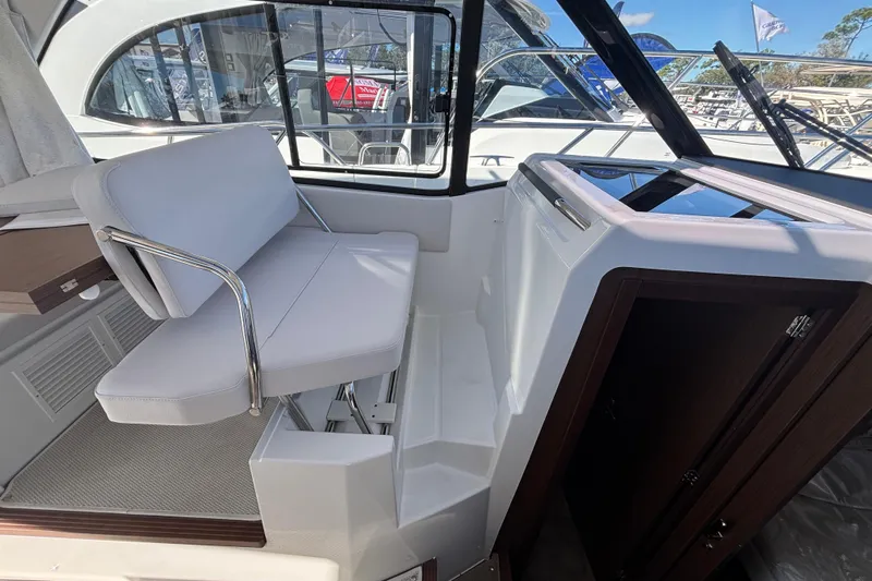  Yacht Photos Pics Interior of 2026 Beneteau Antares 9 V2 boat, featuring a sleek seating area.