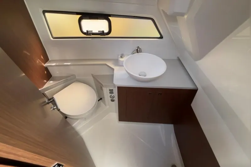  Yacht Photos Pics Modern bathroom interior of 2026 Beneteau Antares 9 V2 boat, featuring sleek design and compact layout.