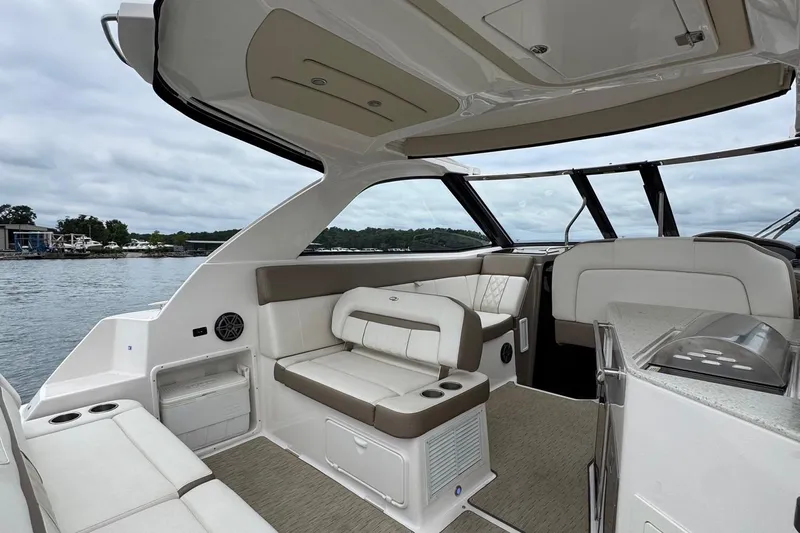  Yacht Photos Pics Interior of 2018 Regal 35 Sport Coupe boat with luxurious seating and scenic water view.