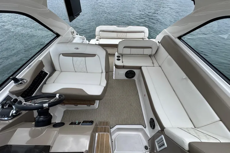  Yacht Photos Pics Luxurious interior of 2018 Regal 35 Sport Coupe boat with plush seating and modern controls.