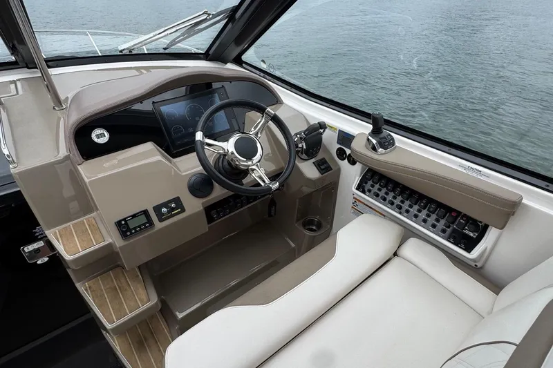  Yacht Photos Pics 2018 Regal 35 Sport Coupe helm with modern controls and luxurious seating.