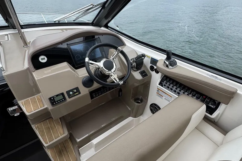  Yacht Photos Pics 2018 Regal 35 Sport Coupe helm with modern controls and navigation system.