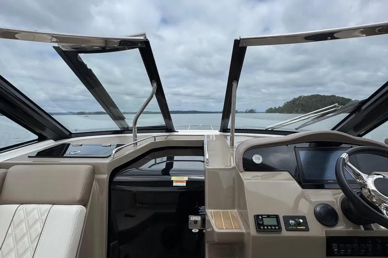  Yacht Photos Pics 2018 Regal 35 Sport Coupe interior with open sunroof, steering wheel, and dashboard view.