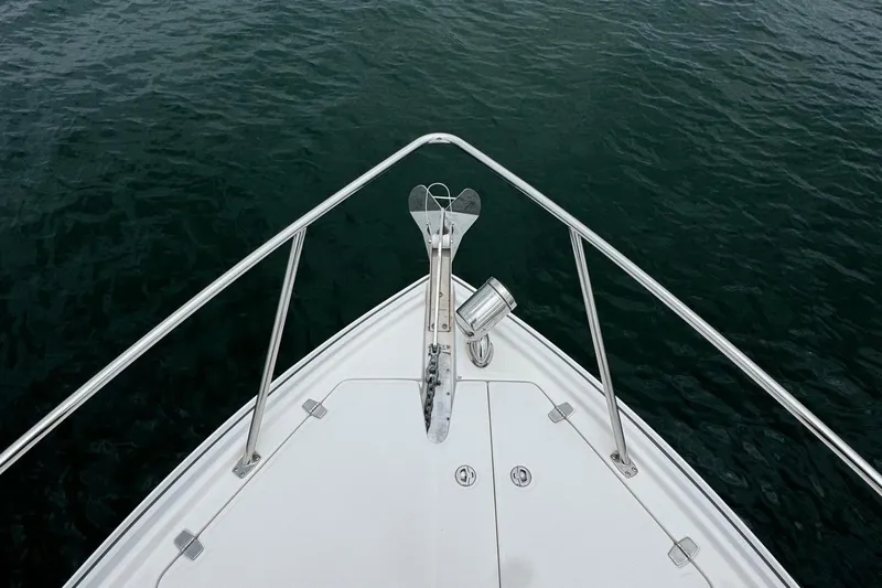  Yacht Photos Pics Bow view of 2018 Regal 35 Sport Coupe on calm water.