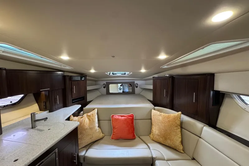  Yacht Photos Pics Luxurious interior of 2018 Regal 35 Sport Coupe with modern furnishings and ambient lighting.