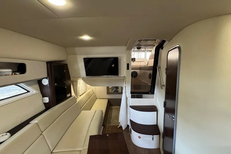  Yacht Photos Pics Interior of 2018 Regal 35 Sport Coupe with beige seating and modern amenities.
