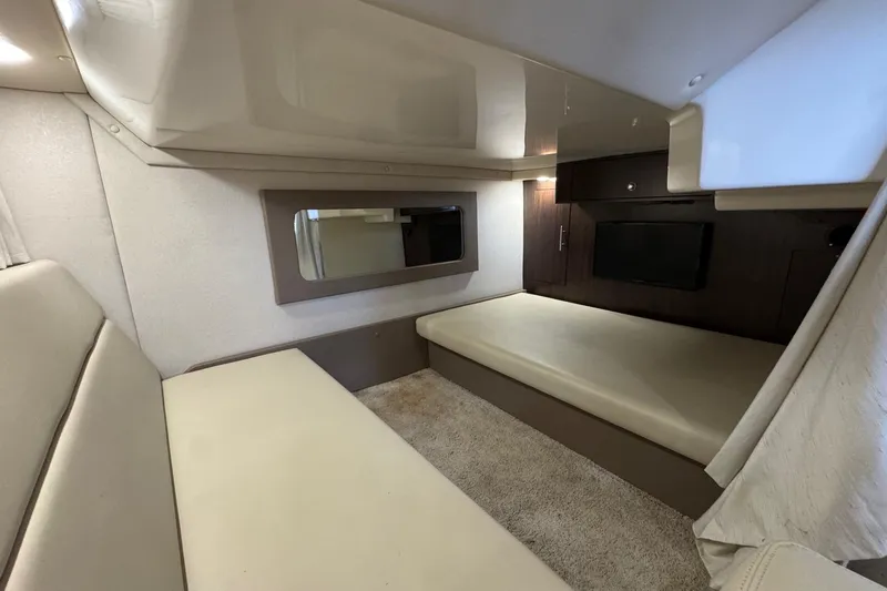  Yacht Photos Pics 2018 Regal 35 Sport Coupe interior cabin with beige seating and modern design.