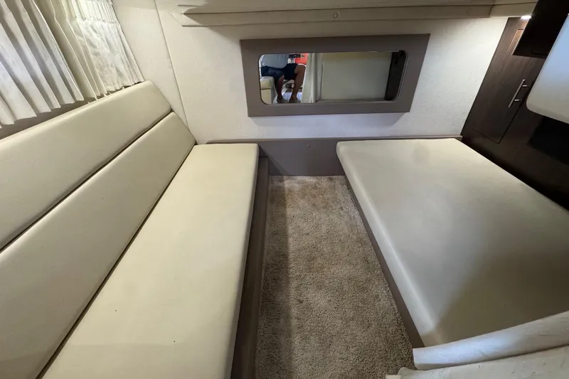  Yacht Photos Pics 2018 Regal 35 Sport Coupe interior with beige seating and carpet.