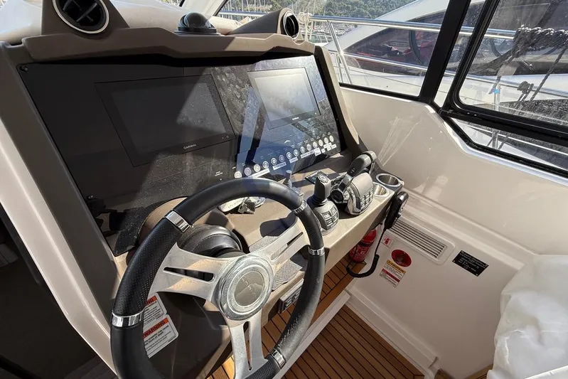 M Yacht Photos Pics Cockpit of 2019 Azimut Atlantis 45 yacht with steering wheel and control panels.