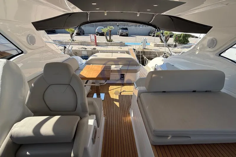 M Yacht Photos Pics Luxurious interior of 2019 Azimut Atlantis 45 yacht with elegant seating and wooden flooring.