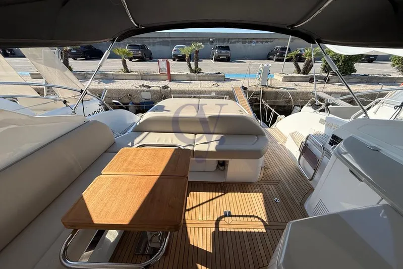 M Yacht Photos Pics 2019 Azimut Atlantis 45 yacht interior with wooden deck and seating area.