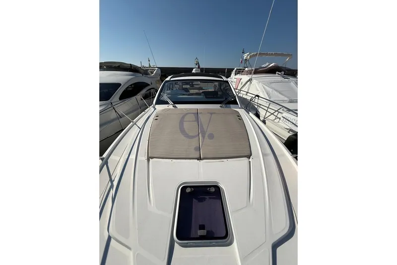 M Yacht Photos Pics 2019 Azimut Atlantis 45 yacht, sleek design, docked alongside other boats under clear sky.