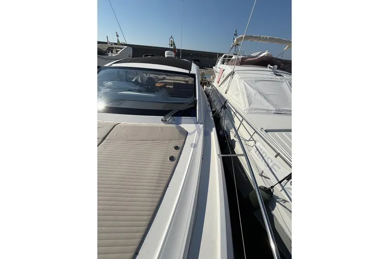 M Yacht Photos Pics 2019 Azimut Atlantis 45 yacht docked alongside other boats under clear sky.