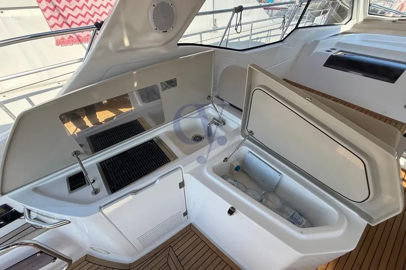 M Yacht Photos Pics 2019 Azimut Atlantis 45 yacht interior with kitchenette and storage compartments.
