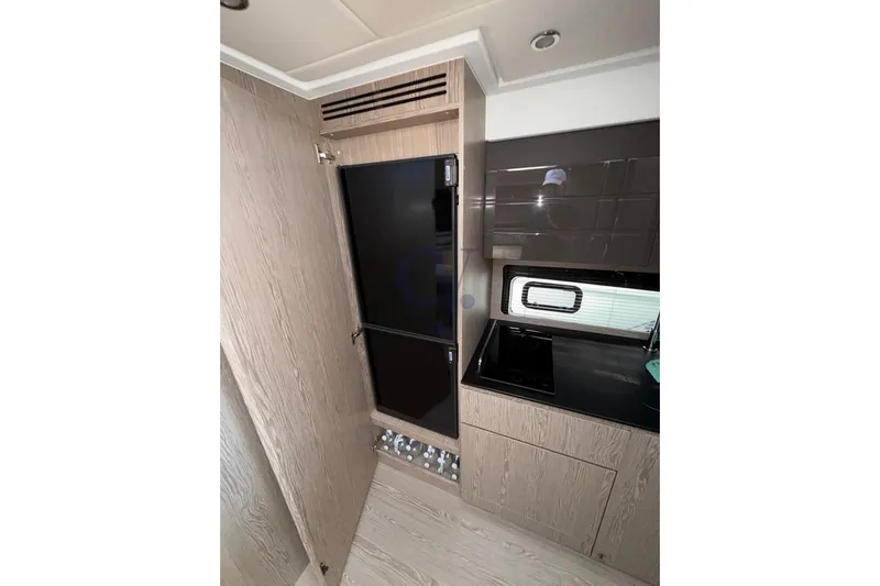 M Yacht Photos Pics Modern kitchen interior of 2019 Azimut Atlantis 45 yacht with sleek cabinetry.