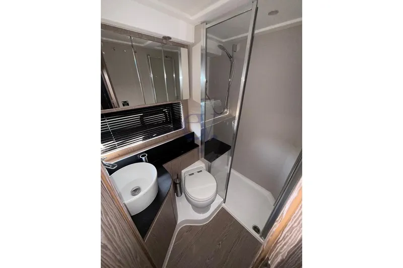 M Yacht Photos Pics Luxurious bathroom in 2019 Azimut Atlantis 45 yacht with modern fixtures and glass shower.