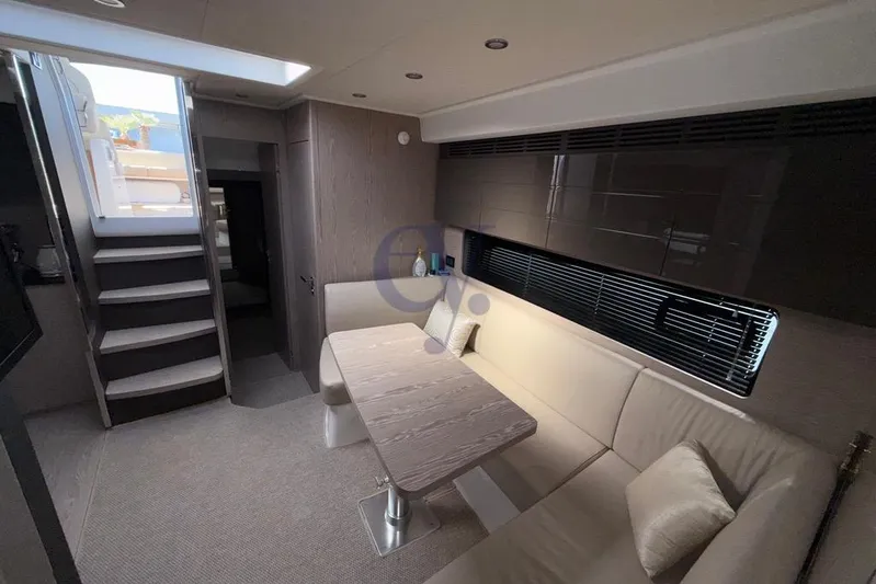 M Yacht Photos Pics Interior of 2019 Azimut Atlantis 45 yacht with modern seating and table.
