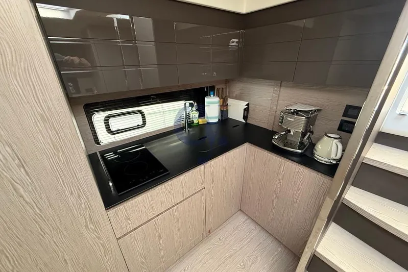 M Yacht Photos Pics Modern kitchen interior of 2019 Azimut Atlantis 45 yacht with appliances and sleek design.