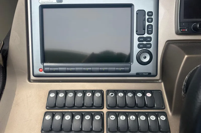  Yacht Photos Pics Control panel of a 2013 Prestige 500 S yacht with navigation and function buttons.
