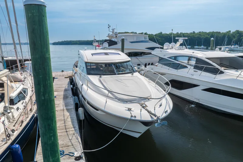  Yacht Photos Pics 2013 Prestige 500 S yacht docked at a marina, surrounded by other boats.