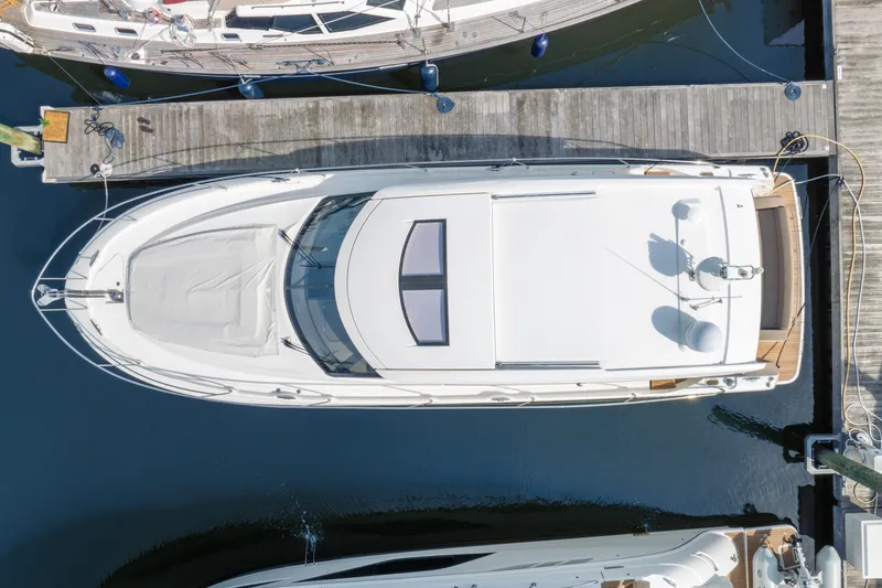  Yacht Photos Pics Aerial view of a 2013 Prestige 500 S yacht docked at a marina.