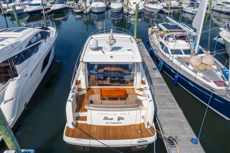  Yacht Photos Pics 2013 Prestige 500 S yacht docked at marina, surrounded by other boats.
