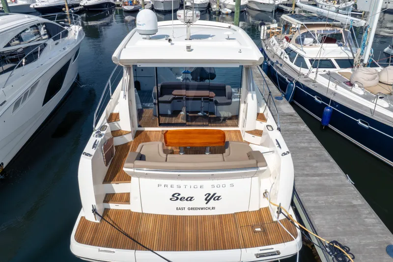  Yacht Photos Pics 2013 Prestige 500 S yacht docked at marina, featuring spacious deck and elegant design.
