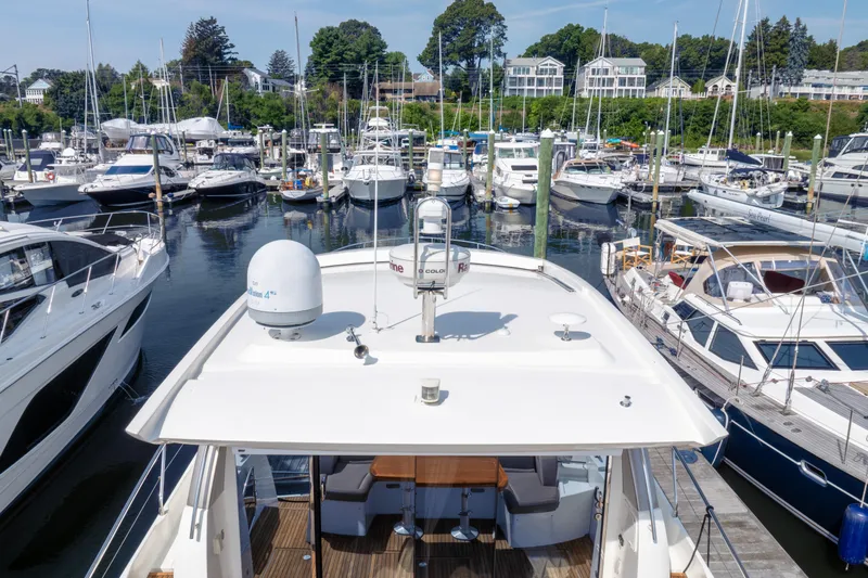  Yacht Photos Pics 2013 Prestige 500 S yacht docked in a marina with surrounding boats.