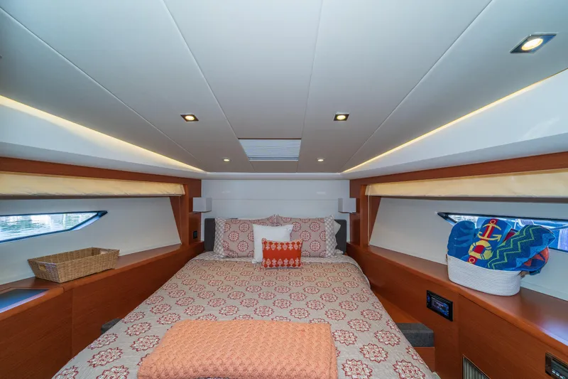  Yacht Photos Pics Luxurious cabin interior of 2013 Prestige 500 S yacht with cozy bedding and modern lighting.