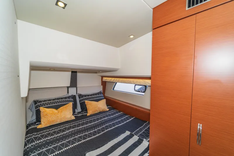  Yacht Photos Pics Luxurious cabin interior of 2013 Prestige 500 S yacht with modern bedding and wood accents.