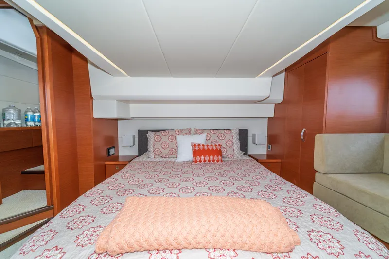  Yacht Photos Pics Luxurious bedroom interior of 2013 Prestige 500 S yacht with elegant bedding and wood accents.