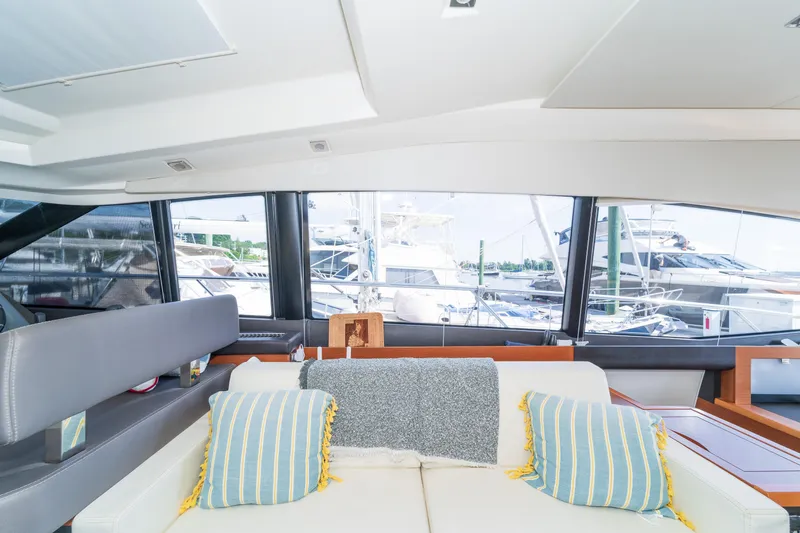  Yacht Photos Pics Interior of 2013 Prestige 500 S yacht with comfortable seating and marina view.
