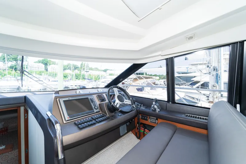  Yacht Photos Pics Interior of 2013 Prestige 500 S yacht cockpit with modern navigation equipment.