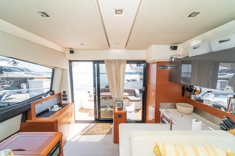  Yacht Photos Pics Interior of 2013 Prestige 500 S yacht, featuring modern kitchen and lounge area.