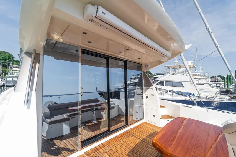  Yacht Photos Pics 2013 Prestige 500 S yacht with sleek deck, glass doors, and marina view.