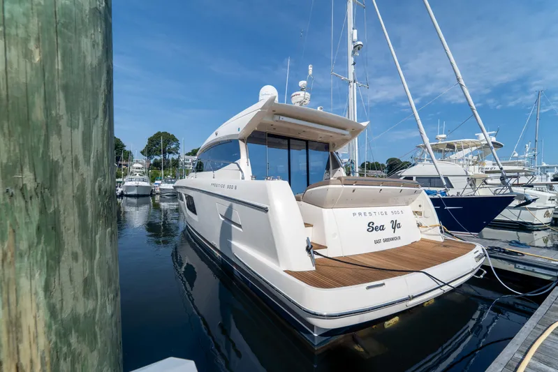 Yacht Photos Pics 2013 Prestige 500 S yacht docked at marina, clear blue sky, luxury boating.
