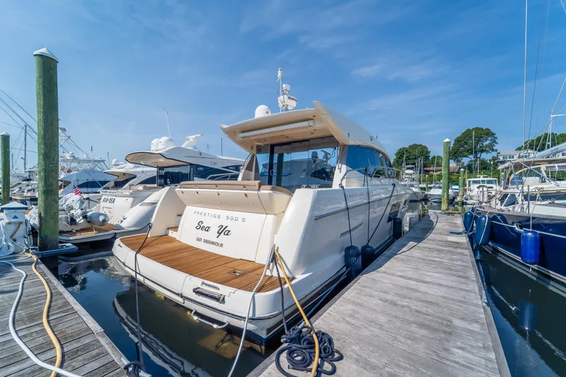  Yacht Photos Pics 2013 Prestige 500 S yacht docked at marina under clear blue sky.