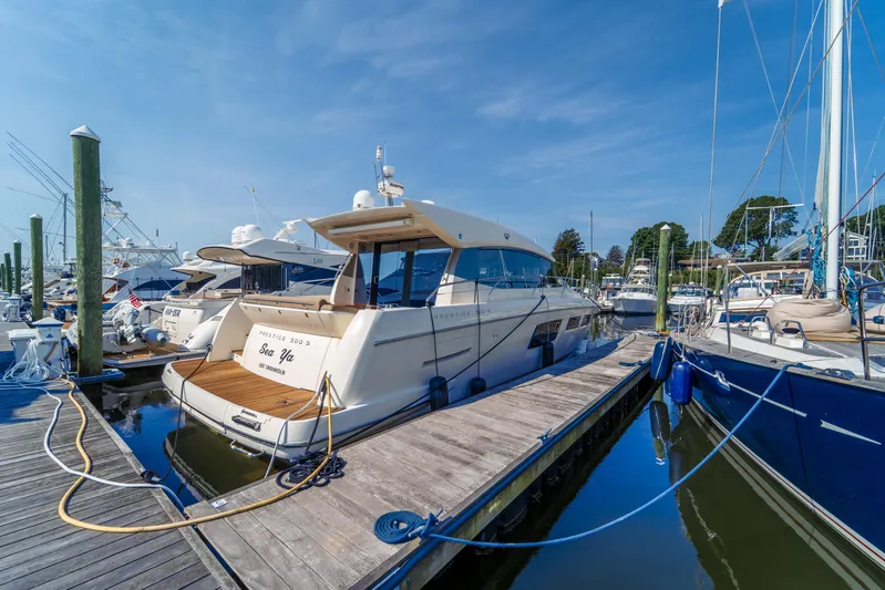  Yacht Photos Pics Luxury 2013 Prestige 500 S yacht docked at marina under clear blue sky.