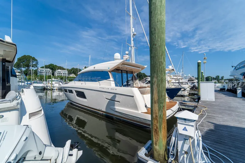  Yacht Photos Pics 2013 Prestige 500 S yacht docked at marina under clear blue sky.
