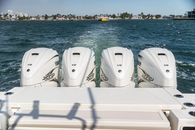  Yacht Photos Pics Four Yamaha V8 outboard engines on a 2021 Pursuit 428 boat, cruising on open water.