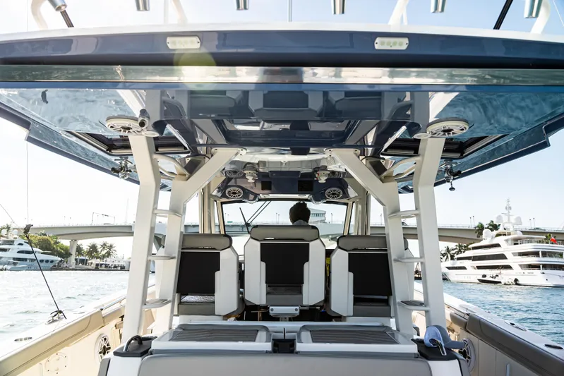  Yacht Photos Pics 2021 Pursuit 428 boat interior with modern seating and ocean view.