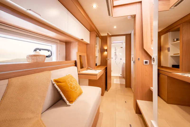 Roxy Yacht Photos Pics Luxurious interior of 2022 Bali 4.4 yacht with modern wood finishes and cozy seating.