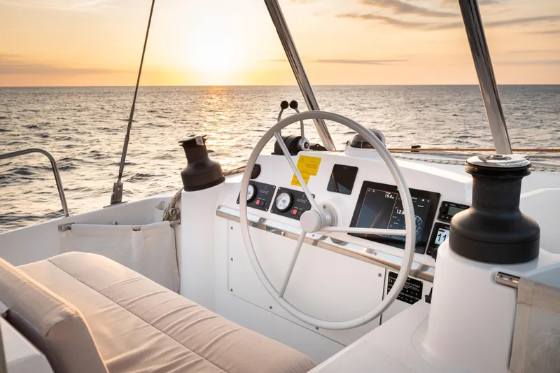 Roxy Yacht Photos Pics 2022 Bali 4.4 yacht helm with sunset view over the ocean.