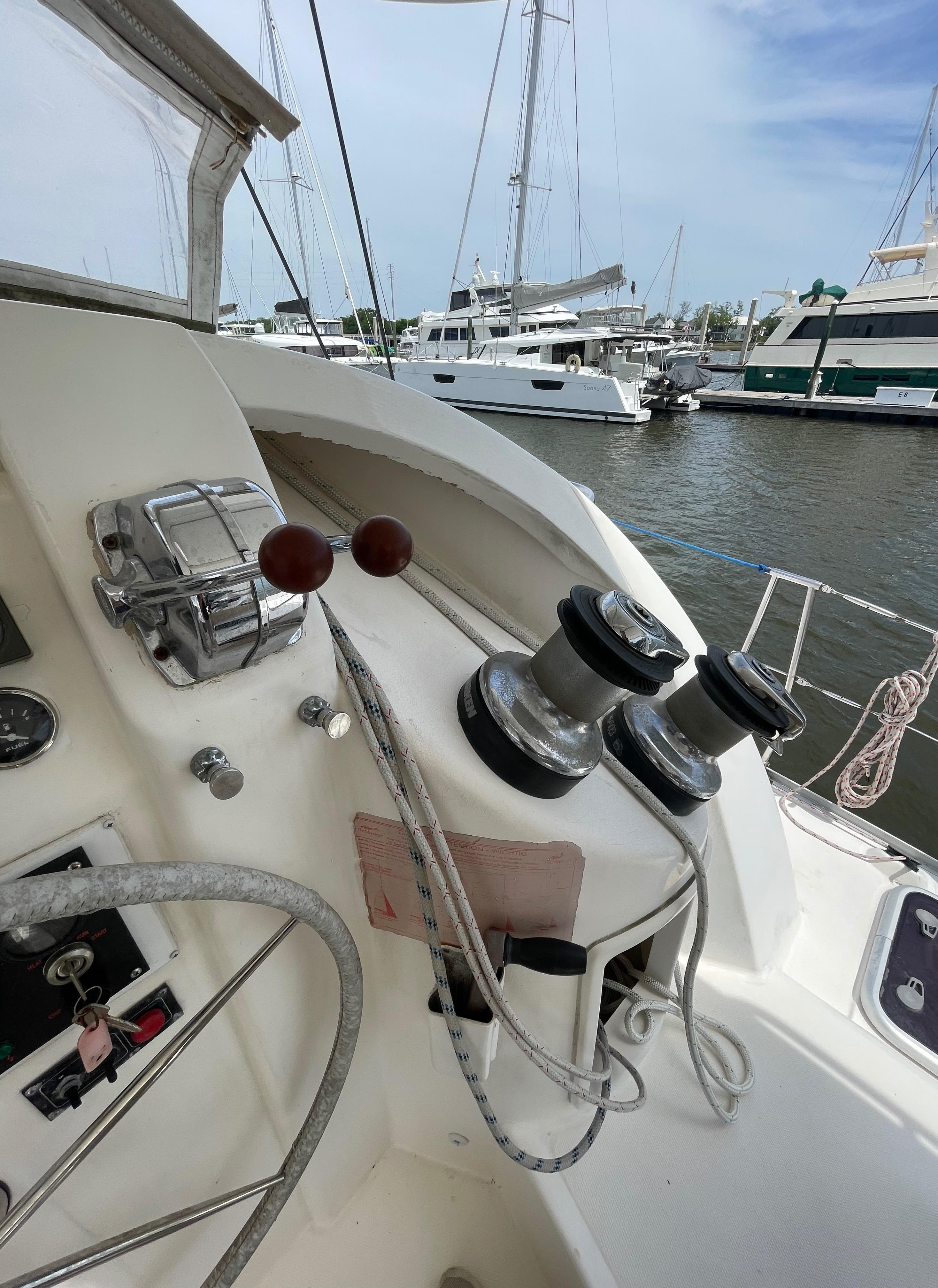 Leopard 40 sailboat cockpit with winches and controls, docked in a marina, 2005 model.